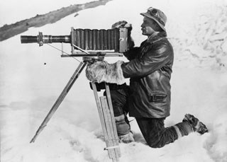 The photographer Ponting with his telephoto apparatus.
